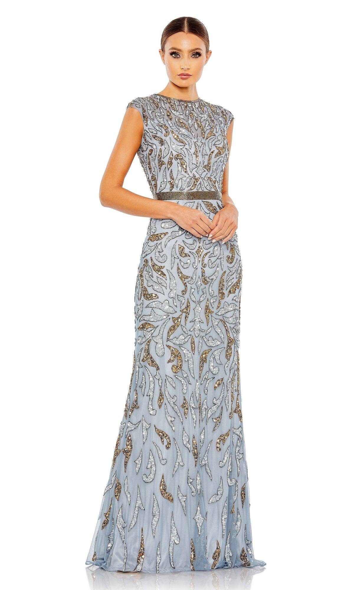 The mother of the bride stands gracefully in the Mac Duggal 5532: a silver, floor-length sequin formal dress, sleeveless and embellished with shimmering beaded patterns.